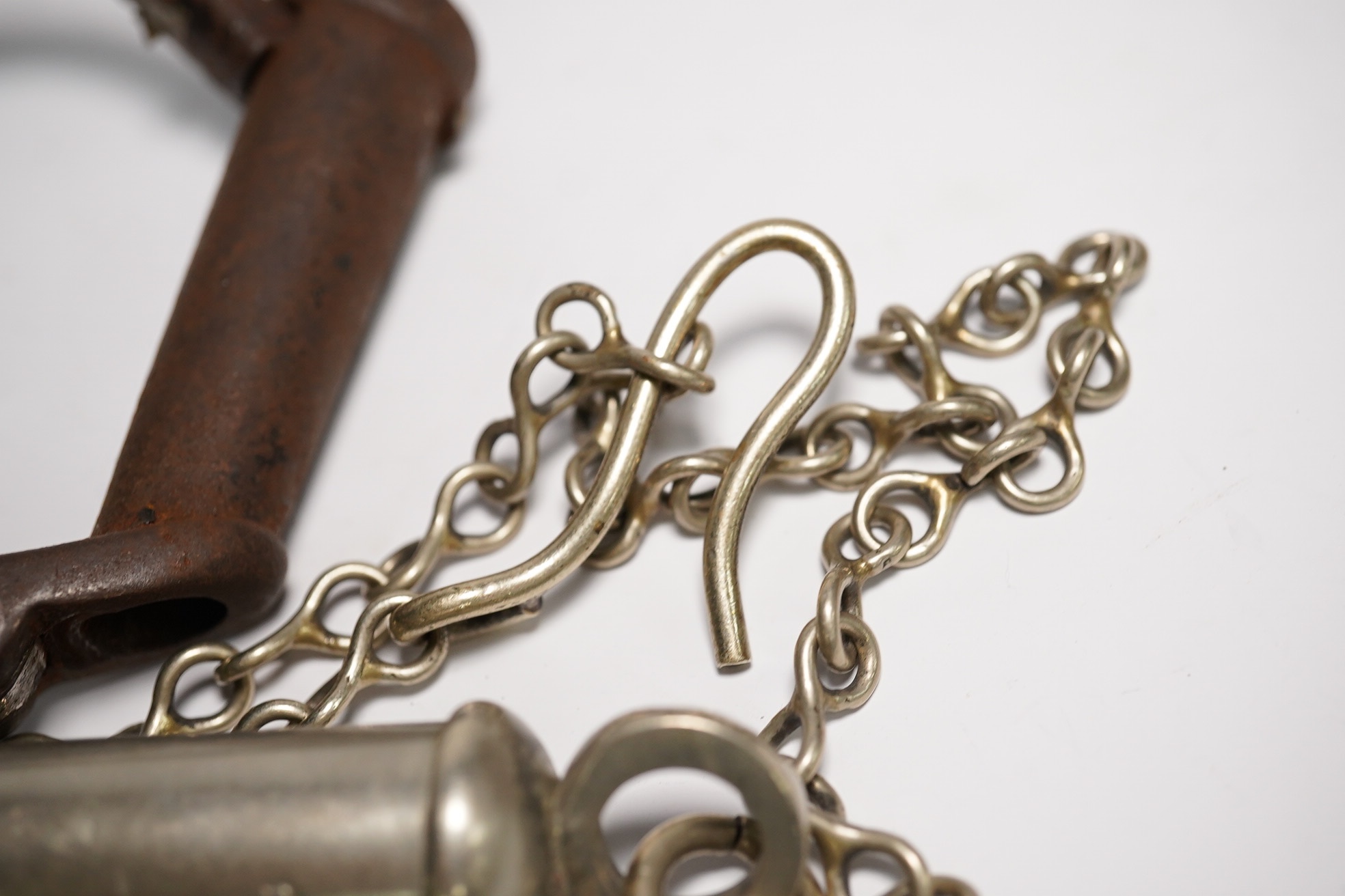 19th/20th century police hand cuffs and two whistles. Condition - poor